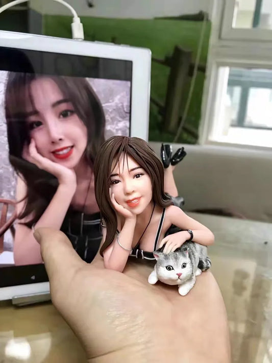 Bobblehead of a person with their pet hand-sculpted in polymer clay from a photo by YOUCLAY