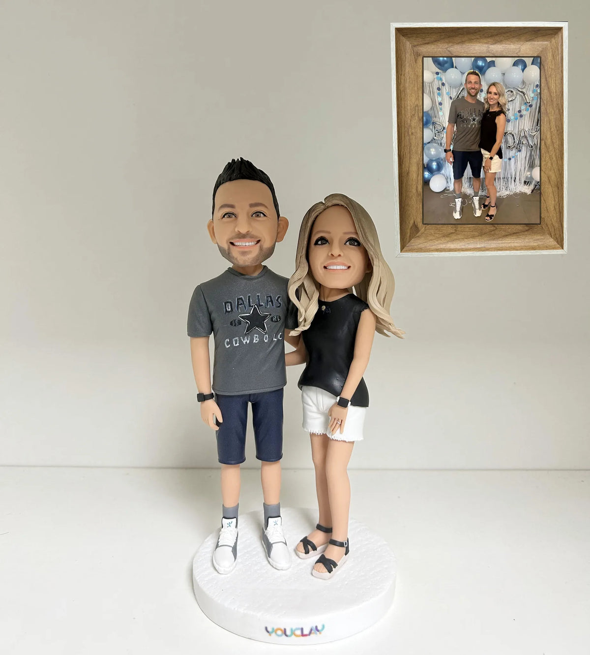 Couple bobbleheads hand-sculpted in polymer clay from a photo by YOUCLAY