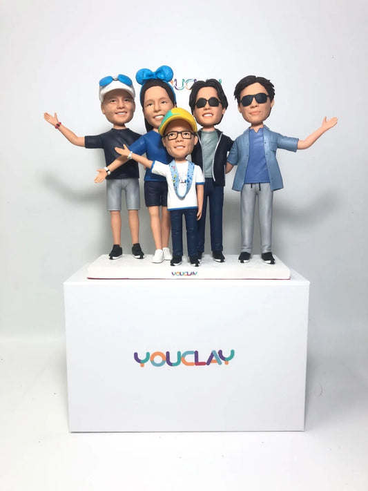 Family of five bobbleheads hand-sculpted in polymer clay from a photo by YOUCLAY