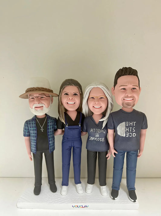Family of four bobbleheads hand-sculpted in polymer clay from a photo by YOUCLAY
