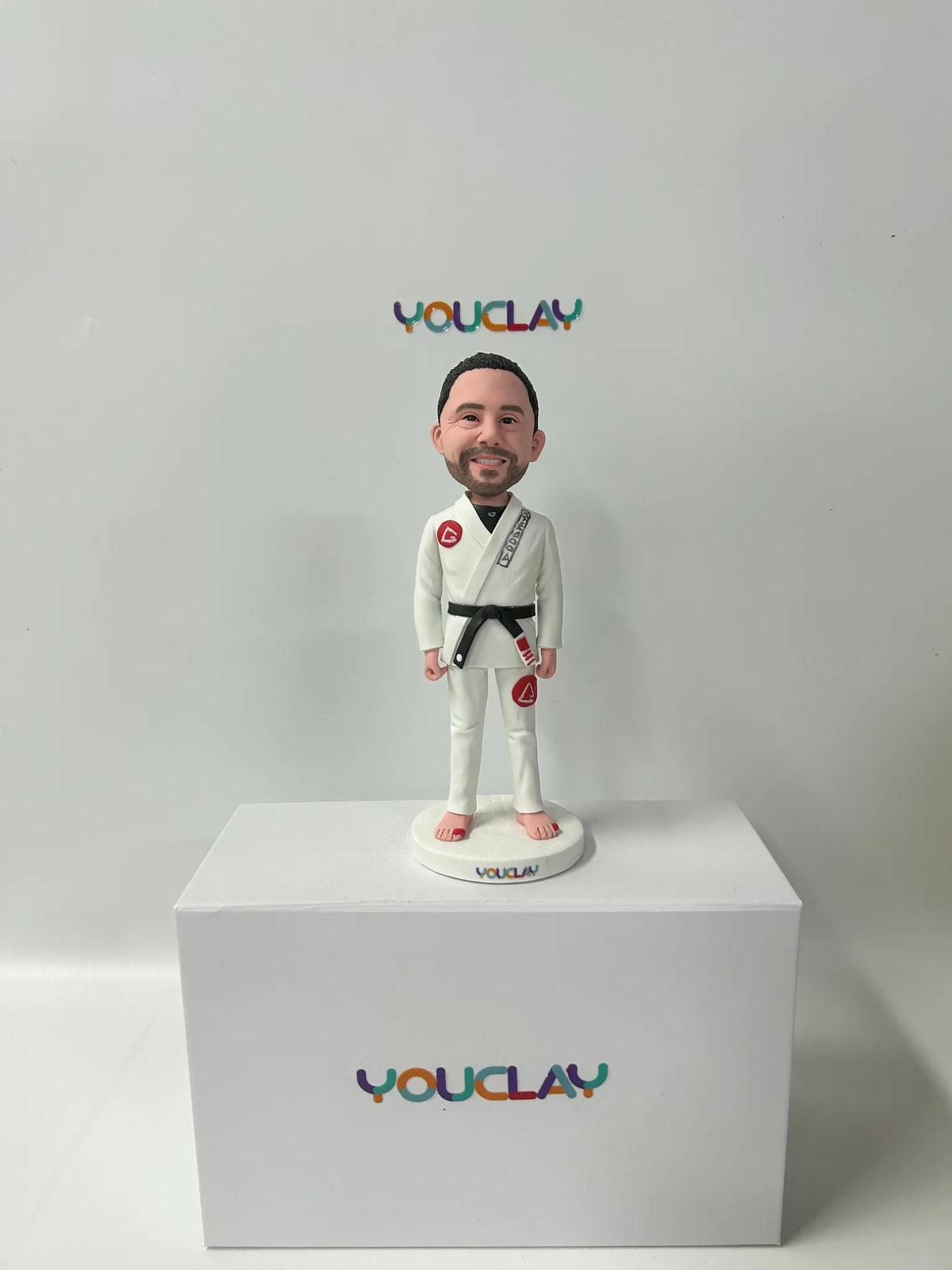 Personalized man bobblehead hand-sculpted in polymer clay from a photo by YOUCLAY
