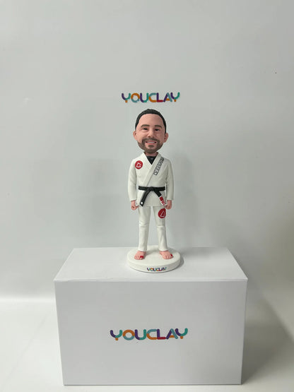 Personalized man bobblehead hand-sculpted in polymer clay from a photo by YOUCLAY