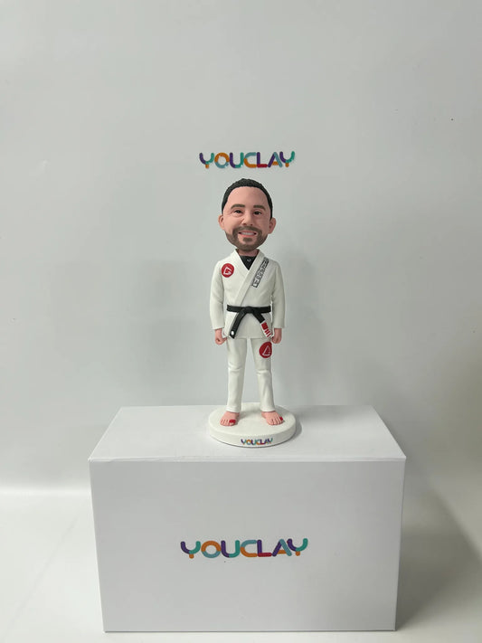 Personalized man bobblehead hand-sculpted in polymer clay from a photo by YOUCLAY