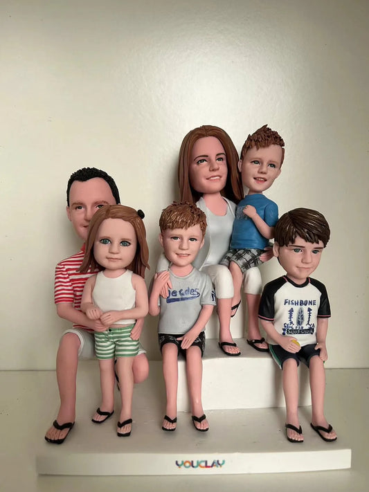 Six-figure family bobbleheads hand-sculpted in polymer clay from a photo by YOUCLAY